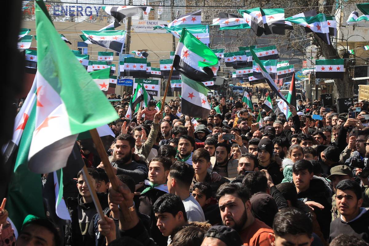 Syrians, holding flags and chanting slogans, stage a demonstration against Bashar al-Assad regime within the 13th anniversary of the Syrian Civil War in Azaz district of Aleppo, Syria on March 15, 2024. [Hişam Hac Ömer - Anadolu Agency]