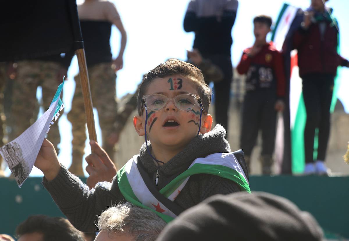 Syrians, holding flags and chanting slogans, stage a demonstration against Bashar al-Assad regime within the 13th anniversary of the Syrian Civil War in Azaz district of Aleppo, Syria on March 15, 2024. [Hişam Hac Ömer - Anadolu Agency]