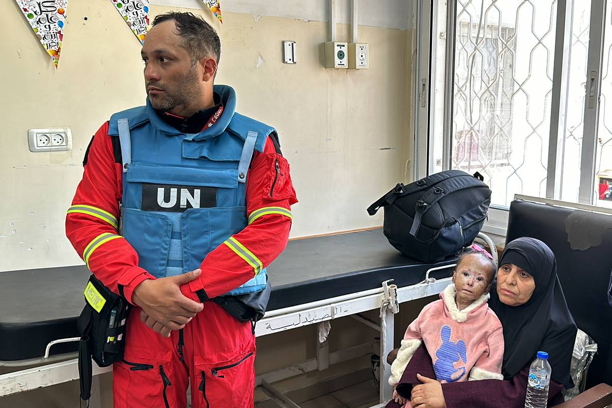 Teams from the World Health Organization (WHO) waiting to pick up 9-year-old cancer patient Nur Jerbu and 6-year-old cystic fibrosis patient Fadi ez-Zenat from Kamal Adwan Hospital in Beit Lahia, Gaza on March 23, 2024. [Karam Hassan - Anadolu Agency]