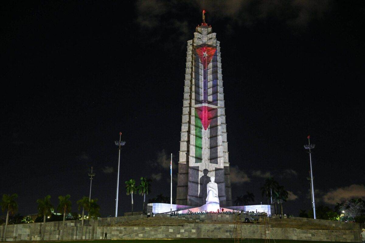 A general view of the Jose Martí Memorial adorned with illuminated Cuban and Palestinian flags, in Havana, Cuba on 17 November, 2023 [Artur Widak/NurPhoto via Getty Images]