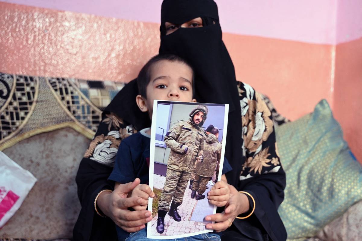 This photo taken on February 22, 2024 shows a picture printout of Indian national Mohammed Asfan. [Photo by NOAH SEELAM/AFP via Getty Images]