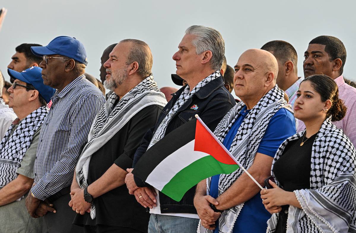 (L-R) Cuba's Foreign Minister Bruno Rodriguez, Cuba's Vice President Salvador Valdes Mesa, Cuba's Prime Minister Manuel Marrero, Cuba's President Miguel Diaz-Canel, Secretary of Organization of the Central Committee of the Communist Party of Cuba Roberto Morales, and a Palestinian woman take part in a demonstration in support of the Palestinian people outside the US Embassy in Havana, on March 2, 2024. [ADALBERTO ROQUE/AFP via Getty Images]