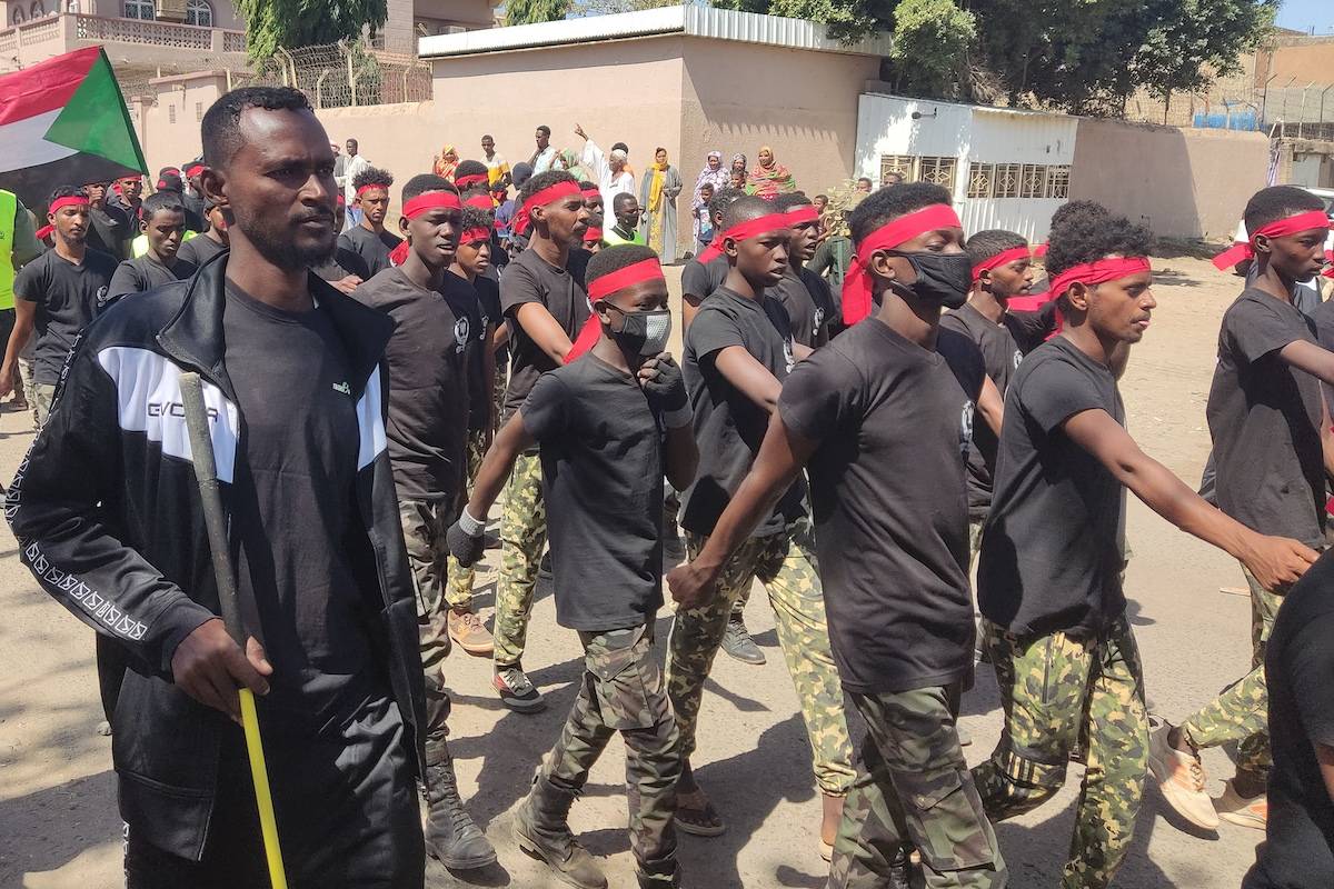 Members of the Sudanese armed popular resistance, which backs the army, parade in the streets of Gedaref in eastern Sudan on March 3, 2024, amid the ongoing conflict in Sudan between the army and paramilitaries. [AFP via Getty Images]