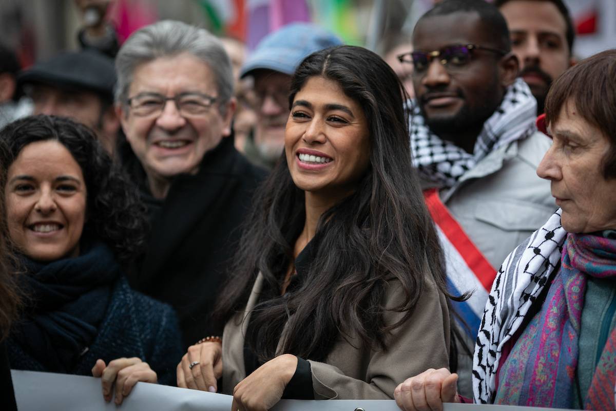 Rima Hassan the new candidate for the European elections of the LFI party, the insubmissive France marches in the company of Jean-Luc Melenchon, Manon Aubry and Carlos Martens Bilongo at the demonstration in support of the Palestinian people in Paris, France on March 9, 2024. [VICTORIA VALDIVIA/Hans Lucas/AFP via Getty Images]