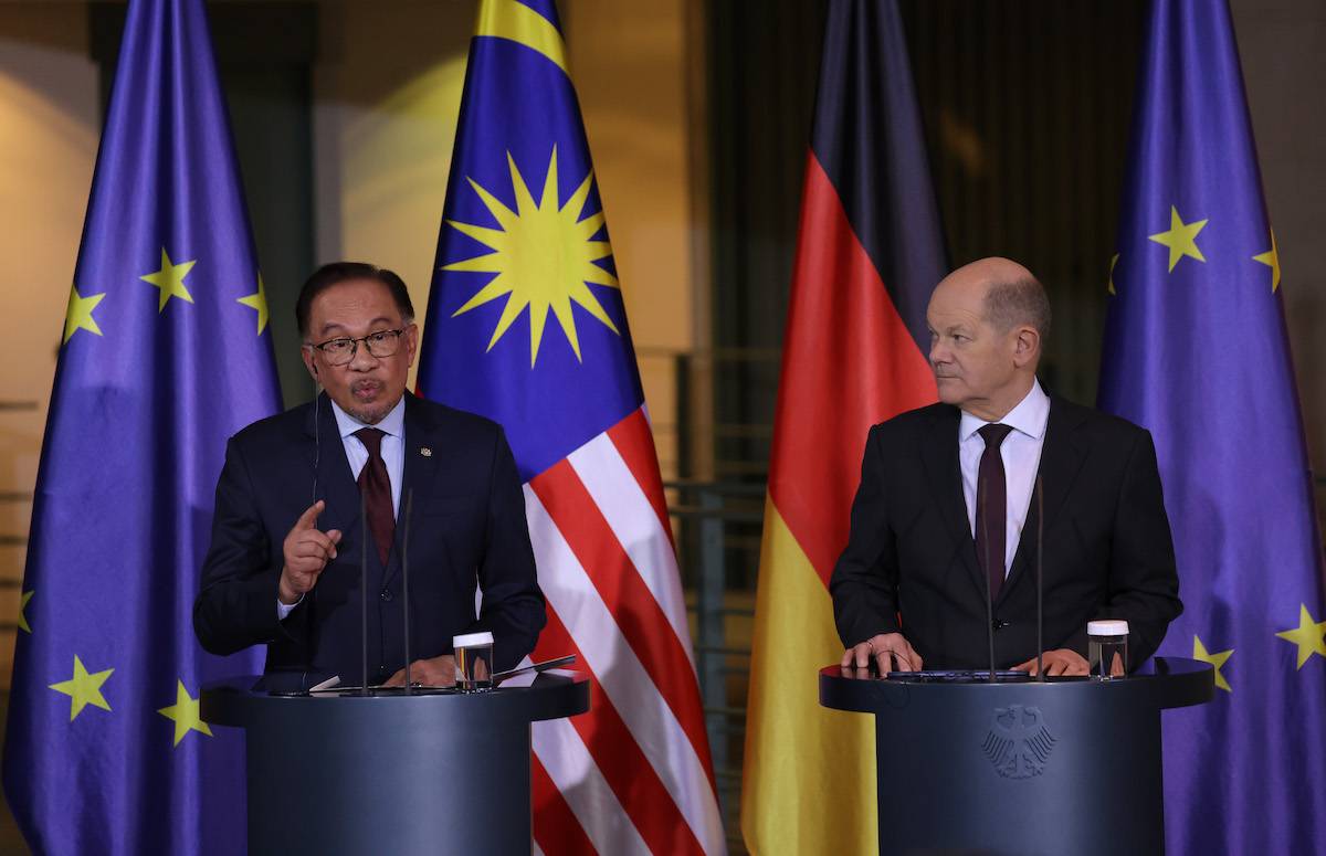 German Chancellor Olaf Scholz (R) and Malaysian Prime Minister Anwar Ibrahim speak to the media during talks at the Chancellery on March 11, 2024 in Berlin, Germany. [Sean Gallup/Getty Images]