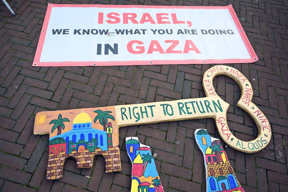 A view of the symbols and banner left on the road as a group of pro-Palestine protesters gather with banners outside the International Court of Justice (ICJ) and show solidarity with the people of Gaza against Israeli attacks in The Hague, Netherlands on April 08, 2024. [ Dursun Aydemir - Anadolu Agency]