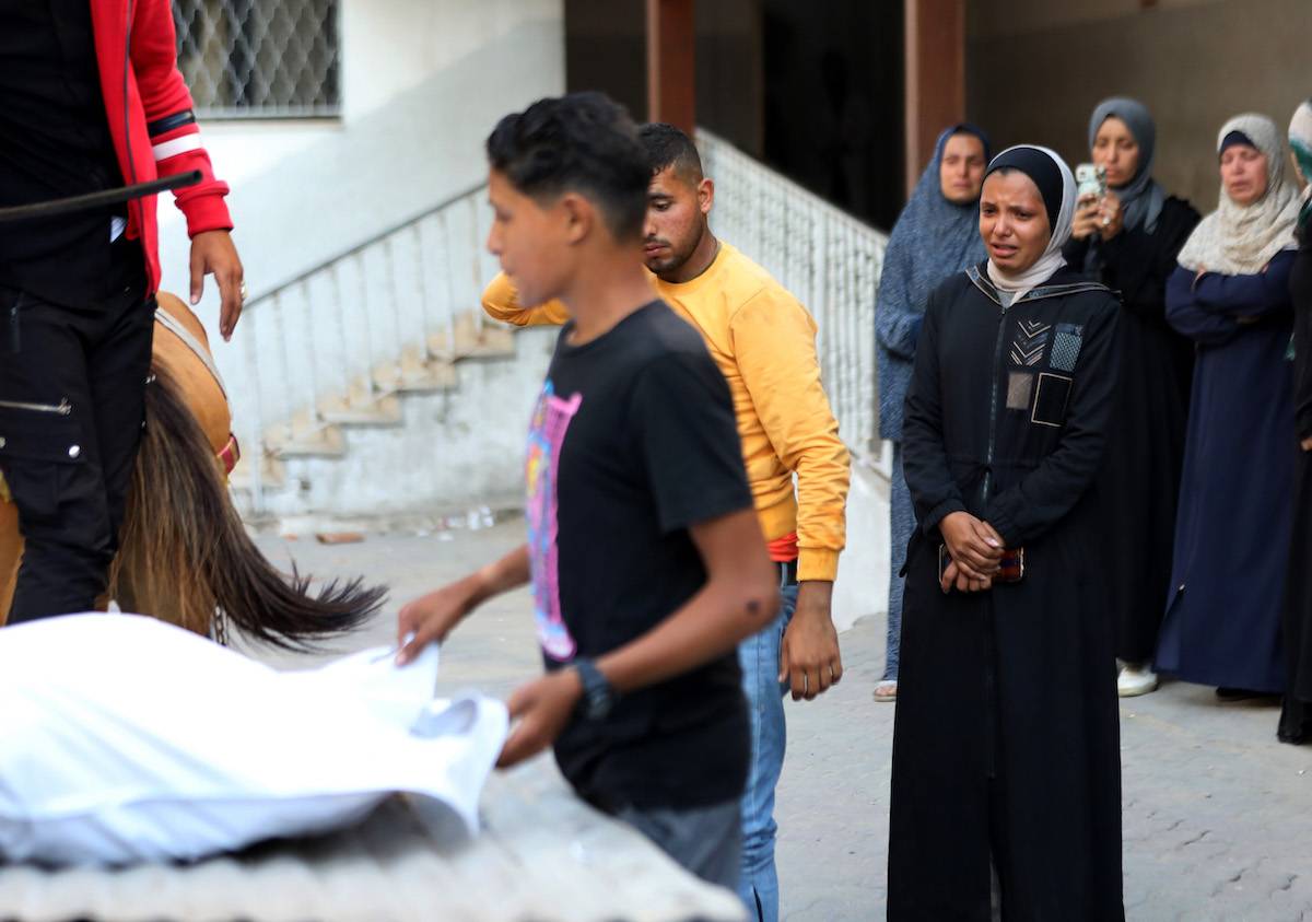 Relatives of Palestinians who lost their lives as a result of the Israeli attack on the second day of the Eid al-Fitr mourn as the bodies are brought to the morgue of al-Ahli Baptist Hospital in Gaza City, Gaza on April 11, 2024. [Dawoud Abo Alkas - Anadolu Agency]