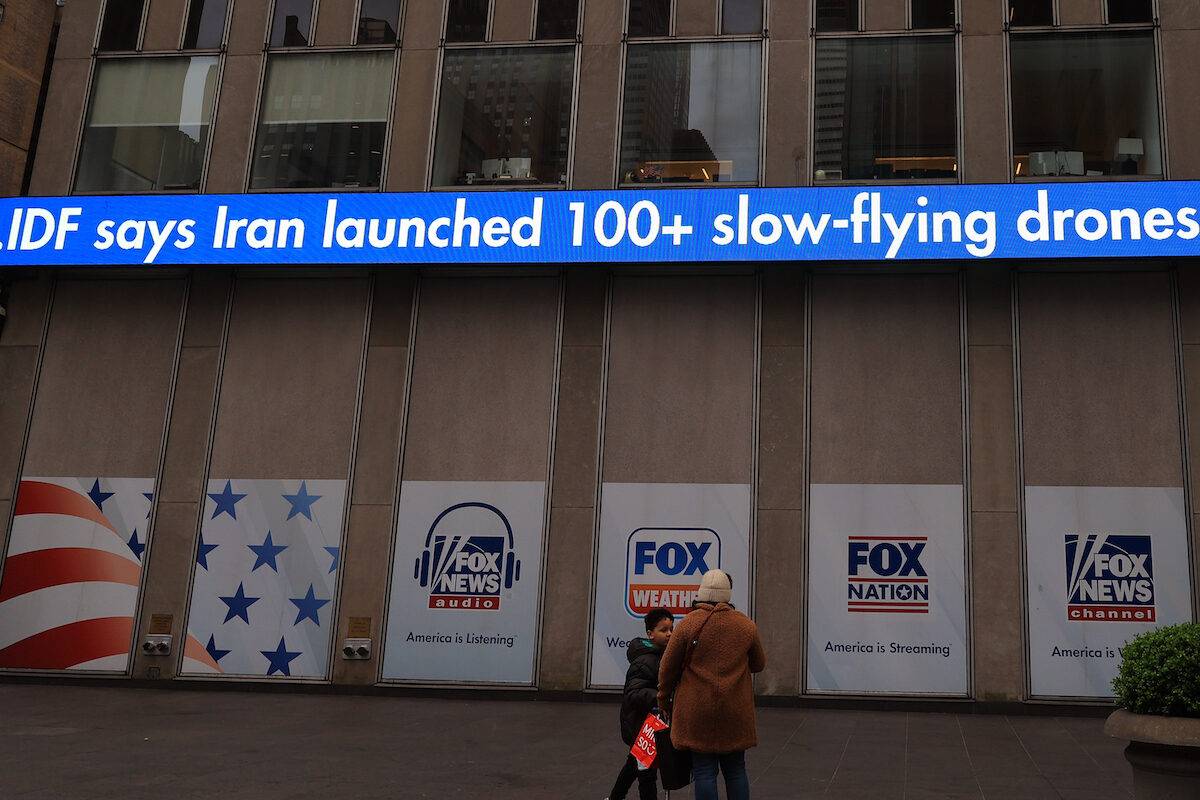 Fox News television channel, a US media outlet, announces Iran's retaliation attack on Israel as a "breaking news" around the building in New York, United States on April 13, 2024. [Selçuk Acar - Anadolu Agency]