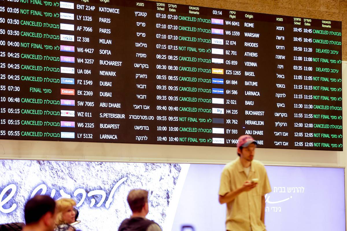 An info-board shows the status of flights as Israel closed its airspace to all domestic and international flights between 01.00-07.00 a.m. were canceled after Iran launched the attack on Israel, at Ben Gurion airport in Tel Aviv, Israel on April 14, 2024. [Nir Keidar - Anadolu Agency]