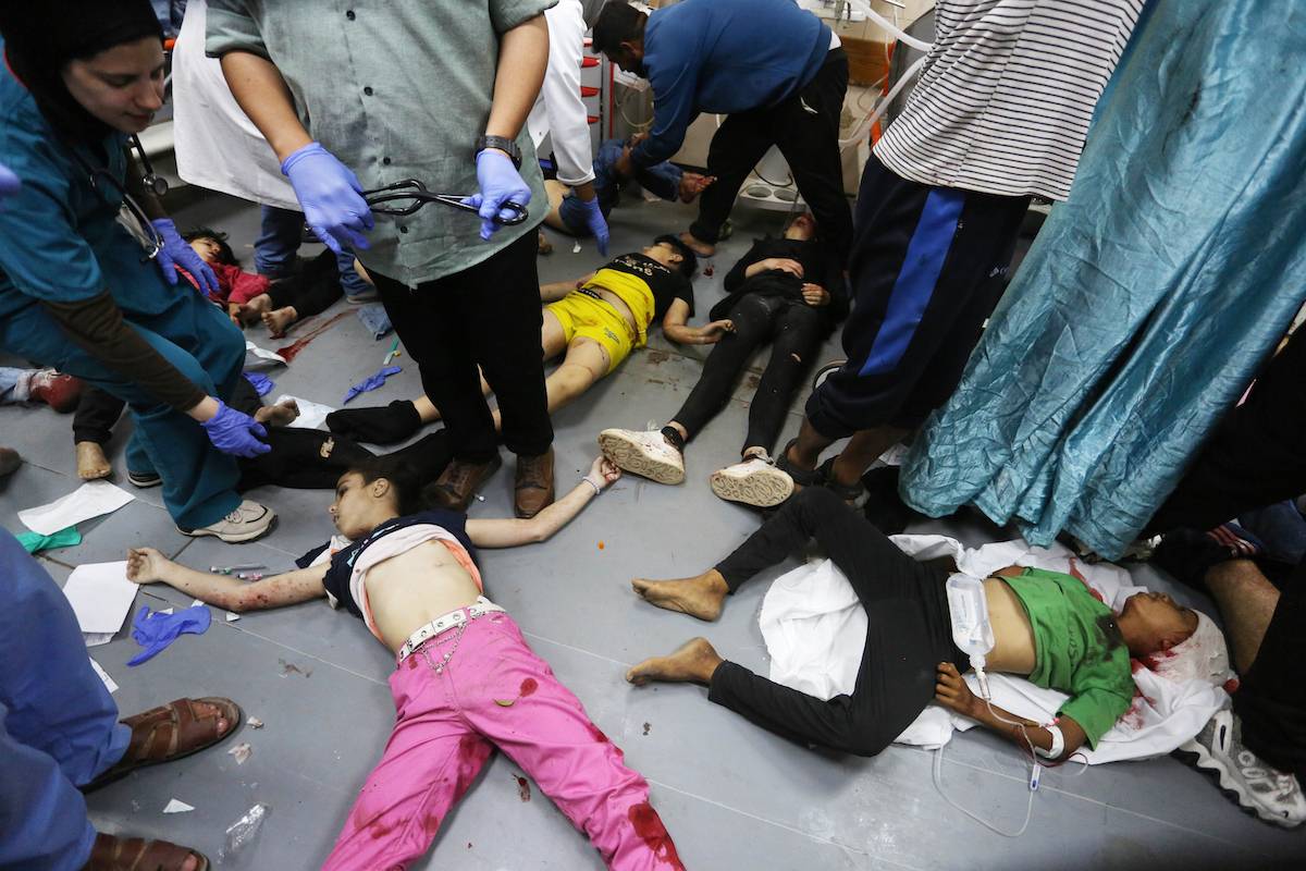 Killed Palestinian children lay on hospital floor after being taken to the hospital following the Israeli attack on Maghazi refugee camp area in Deir al-Balah, Gaza on April 16, 2024. [Ashraf Amra - Anadolu Agency]