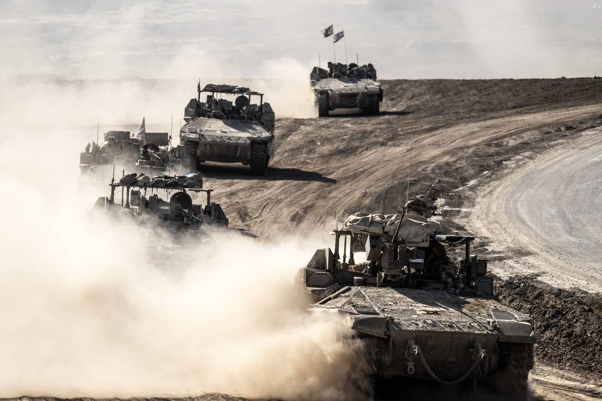 Tanks, armored vehicles and military machinery belonging to the Israeli army withdraw from the central Gaza Strip, seen from Israel on April 17, 2024. [Mostafa Alkharouf - Anadolu Agency]