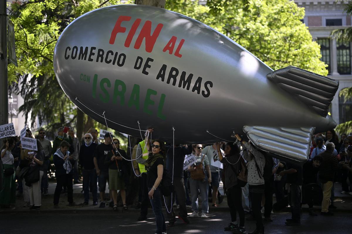 Pro-Palestinian demonstrators gather with Palestinian flag and banners to protest against Israeli attacks on Gaza in Madrid, Spain on April 21, 2024. [Burak Akbulut - Anadolu Agency]