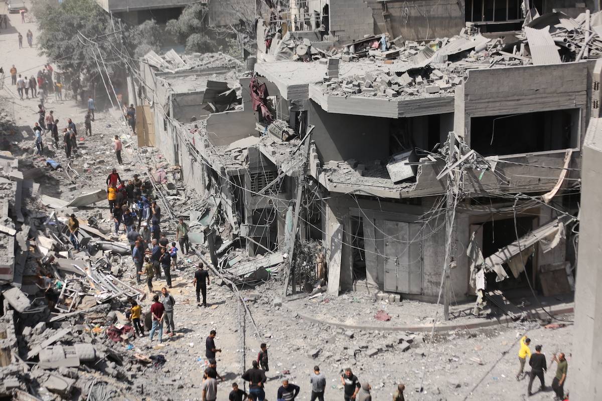 Buildings are destroyed and surrounding buildings and vehicles were heavily damaged at al-Daraj neighbourhood after Israeli attack, in Gaza City, Gaza on April 22, 2024. [Dawoud Abo Alkas - Anadolu Agency]