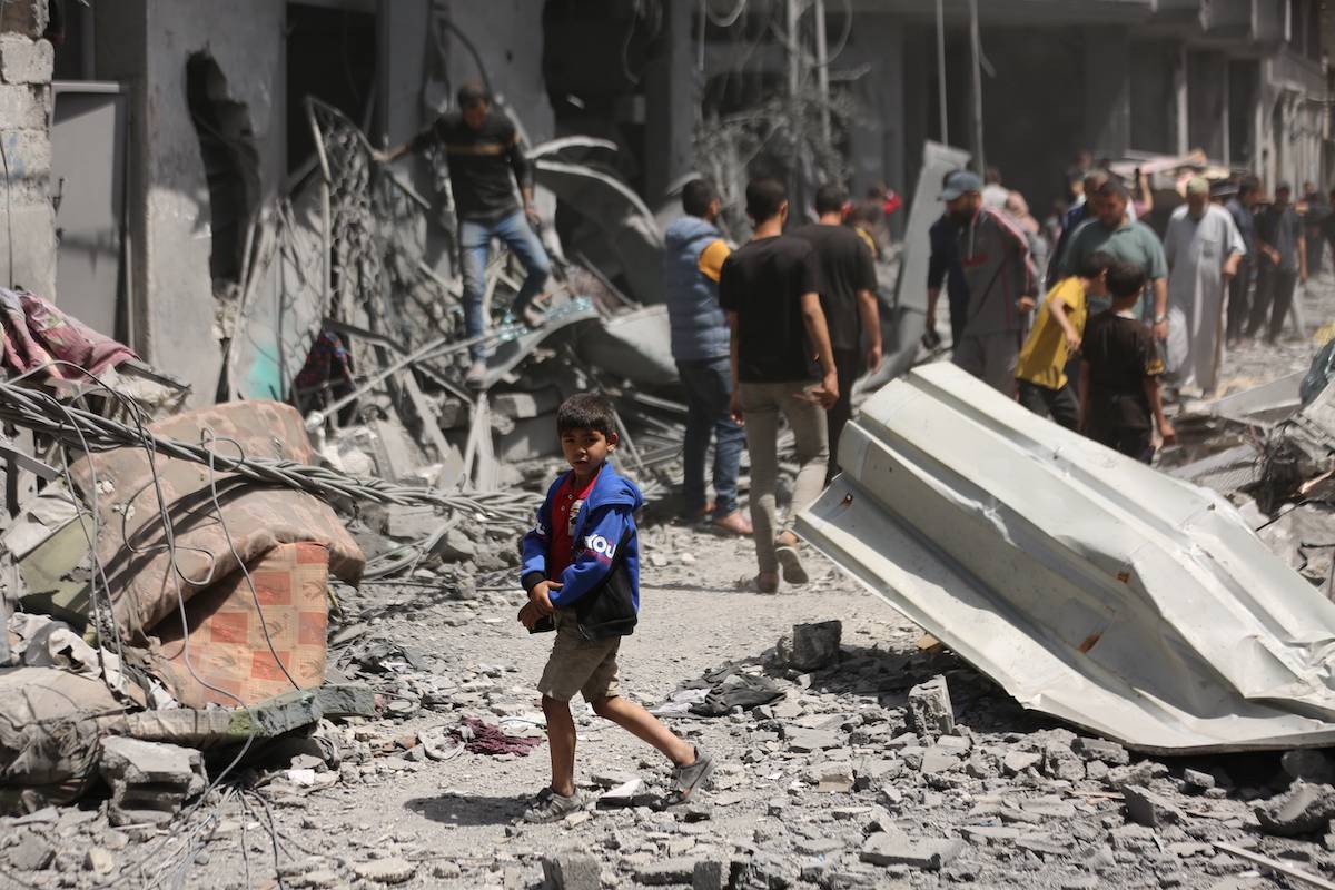 Buildings are destroyed and surrounding buildings and vehicles were heavily damaged at al-Daraj neighbourhood after Israeli attack, in Gaza City, Gaza on April 22, 2024. [Dawoud Abo Alkas - Anadolu Agency]