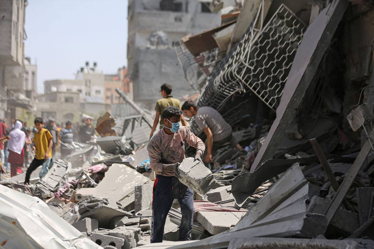 Buildings are destroyed and surrounding buildings and vehicles were heavily damaged at al-Daraj neighbourhood after Israeli attack, in Gaza City, Gaza on April 22, 2024. [Dawoud Abo Alkas - Anadolu Agency]