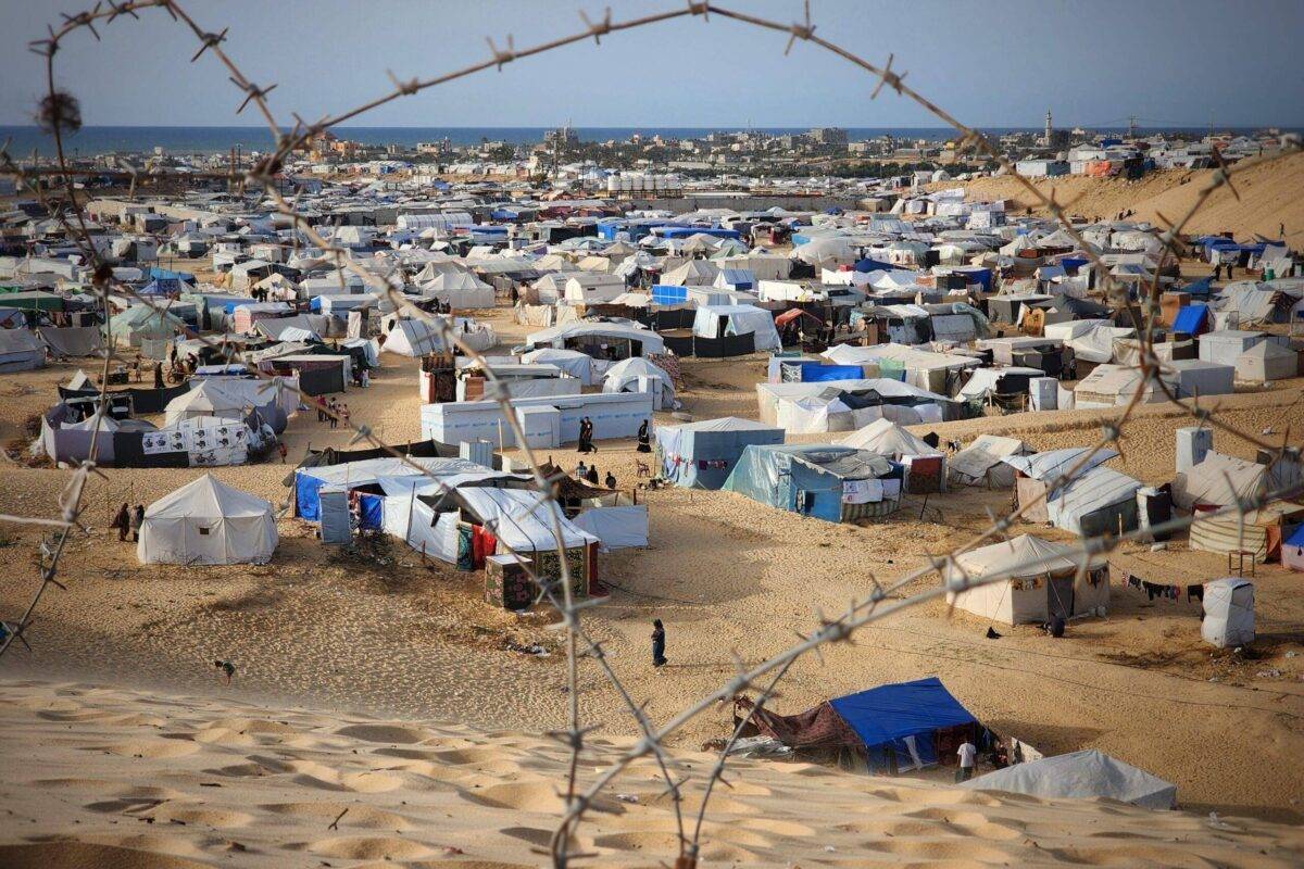 Palestinians who left their homes and took refuge in Rafah try to survive under harsh conditions in makeshift tents they set up in the empty land as Israeli attacks continue on Gaza on April 22, 2024 [Hani Alshaer/Anadolu Agency]