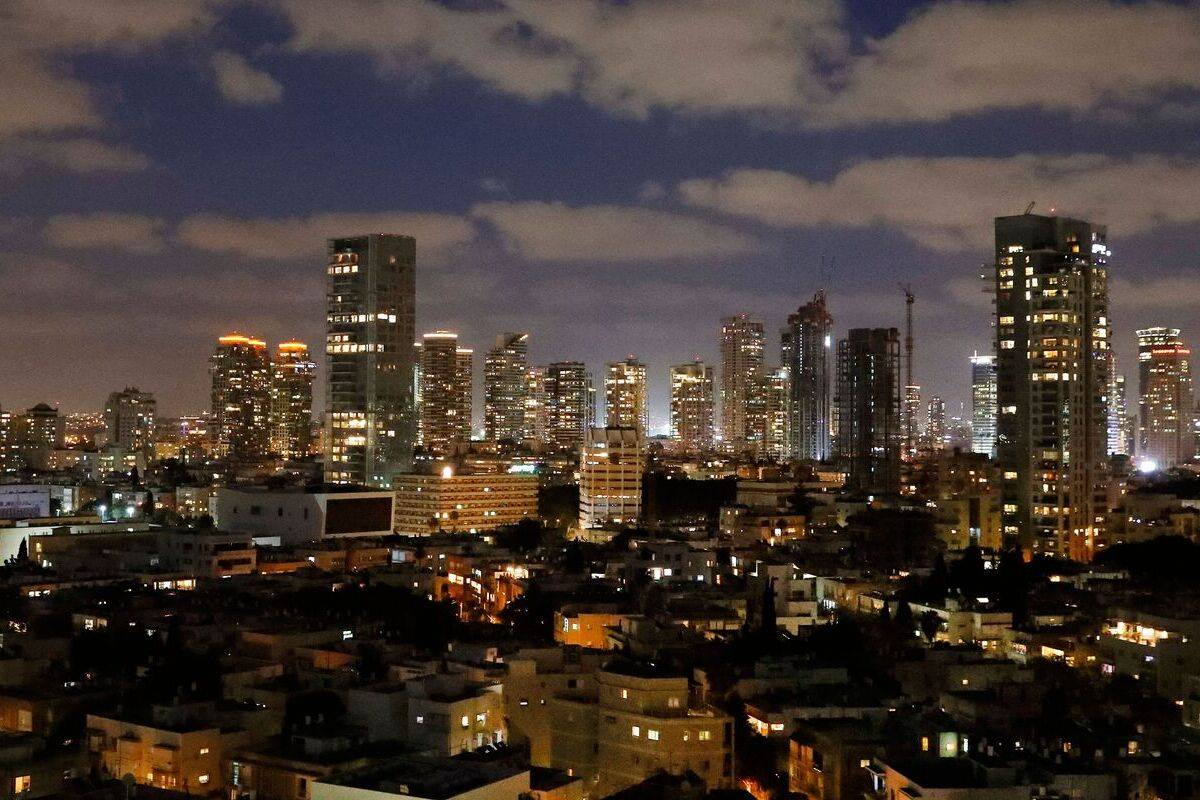 General view of the skyline of buildings in Israel's Mediterranean coastal city of Tel Aviv in the early evening. [Photo by JACK GUEZ/AFP via Getty Images]