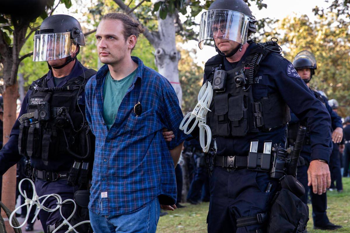 Members of the law enforcement and police officers intervene the Pro-Palestinian student protesters as they gather to protest Israel attacks over Gaza, at University of Southern California in Los Angeles, California, United States on April 24, 2024. [Grace Hie Yoon - Anadolu Agency]