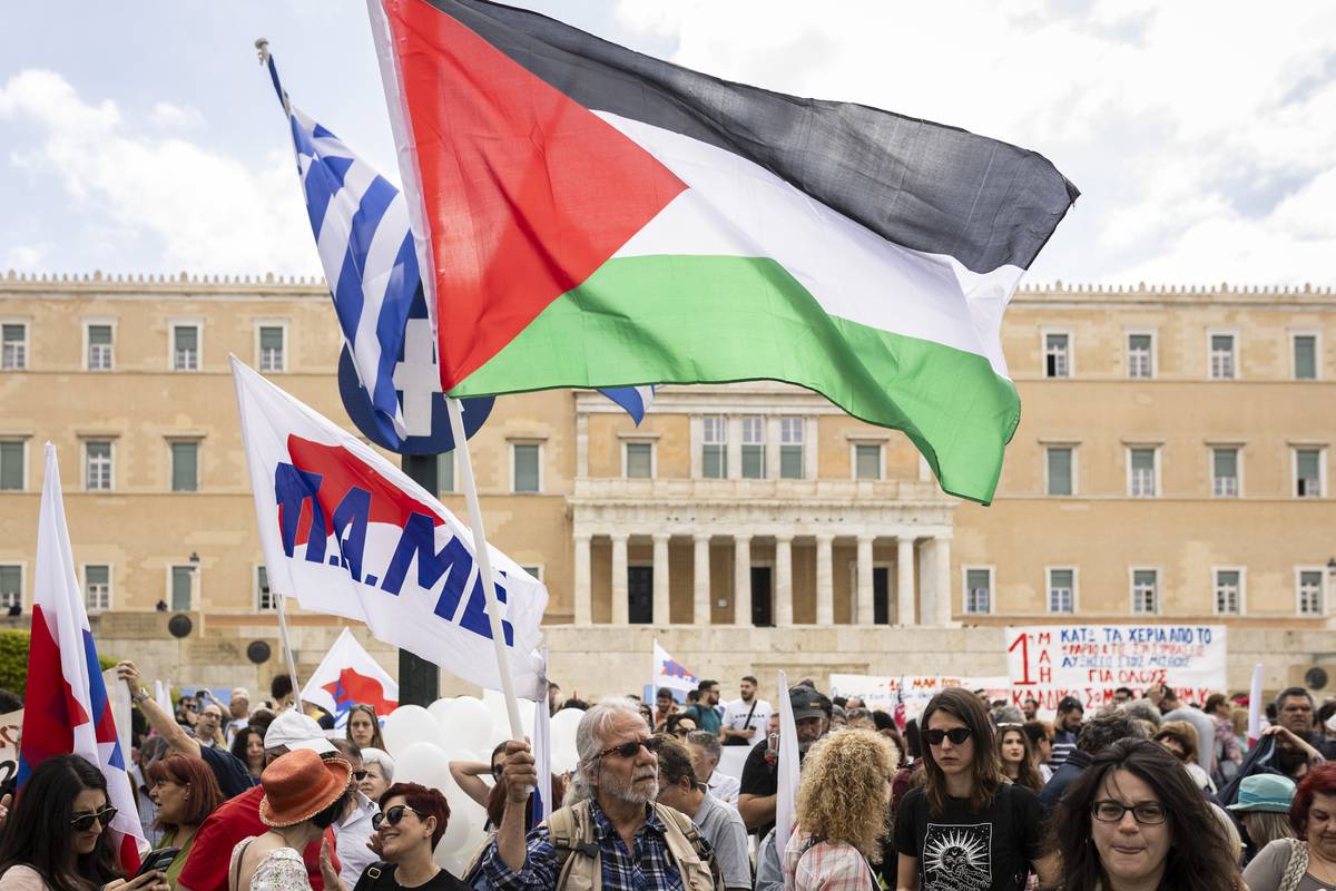 Members of the pro-communist union PAME take part in a demonstration in front of Greek Parliament to mark May Day (International Labour Day) in Athens, Greece, on May 1, 2024. [Socrates Baltagiannis - Anadolu Agency]