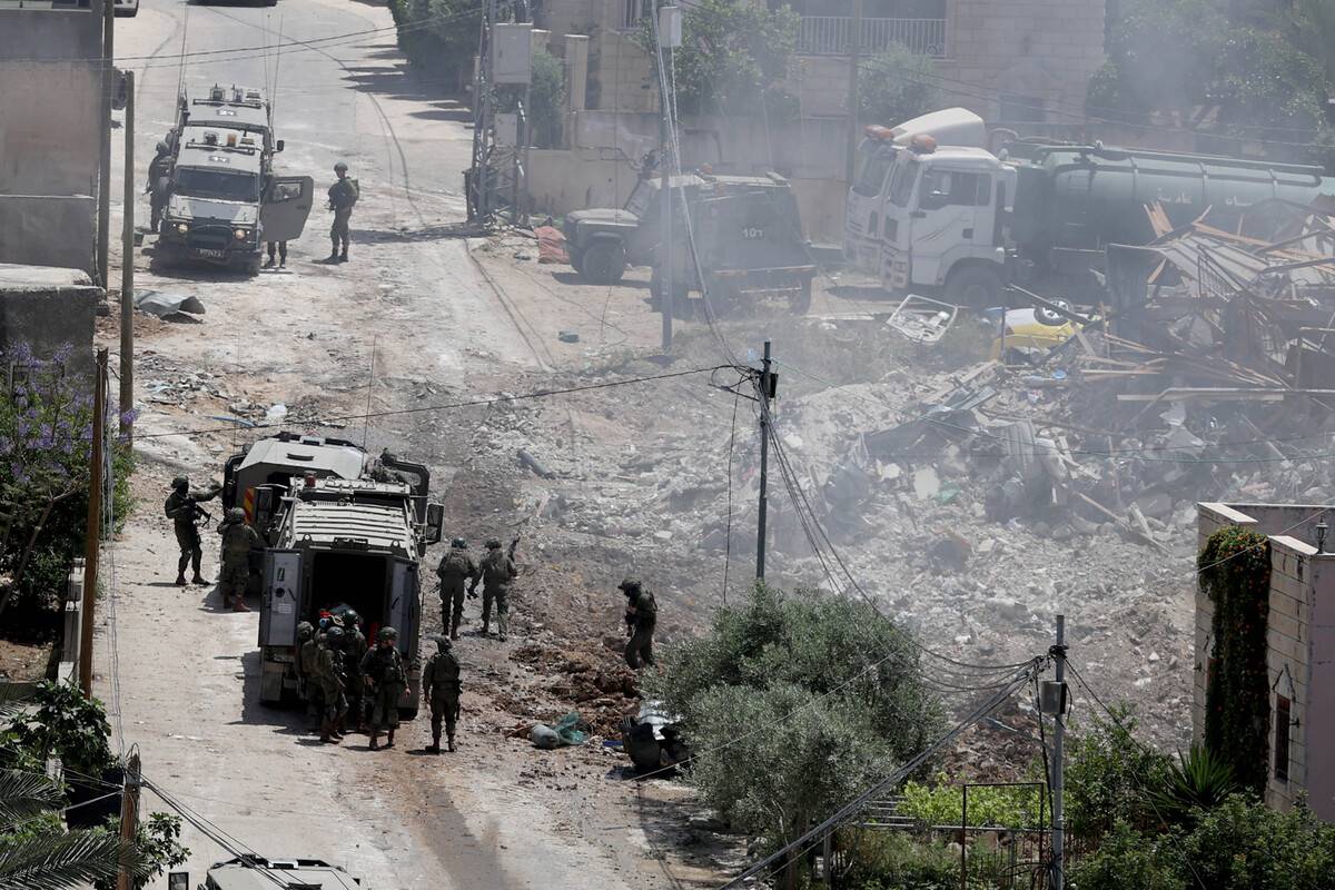 Israeli forces recover the lifeless body of a Palestinian from the rubble after they demolished a house as they storm Deir al-Ghusun town in Tulkarm, West Bank on May 04, 2024. [Issam Rimawi - Anadolu Agency]
