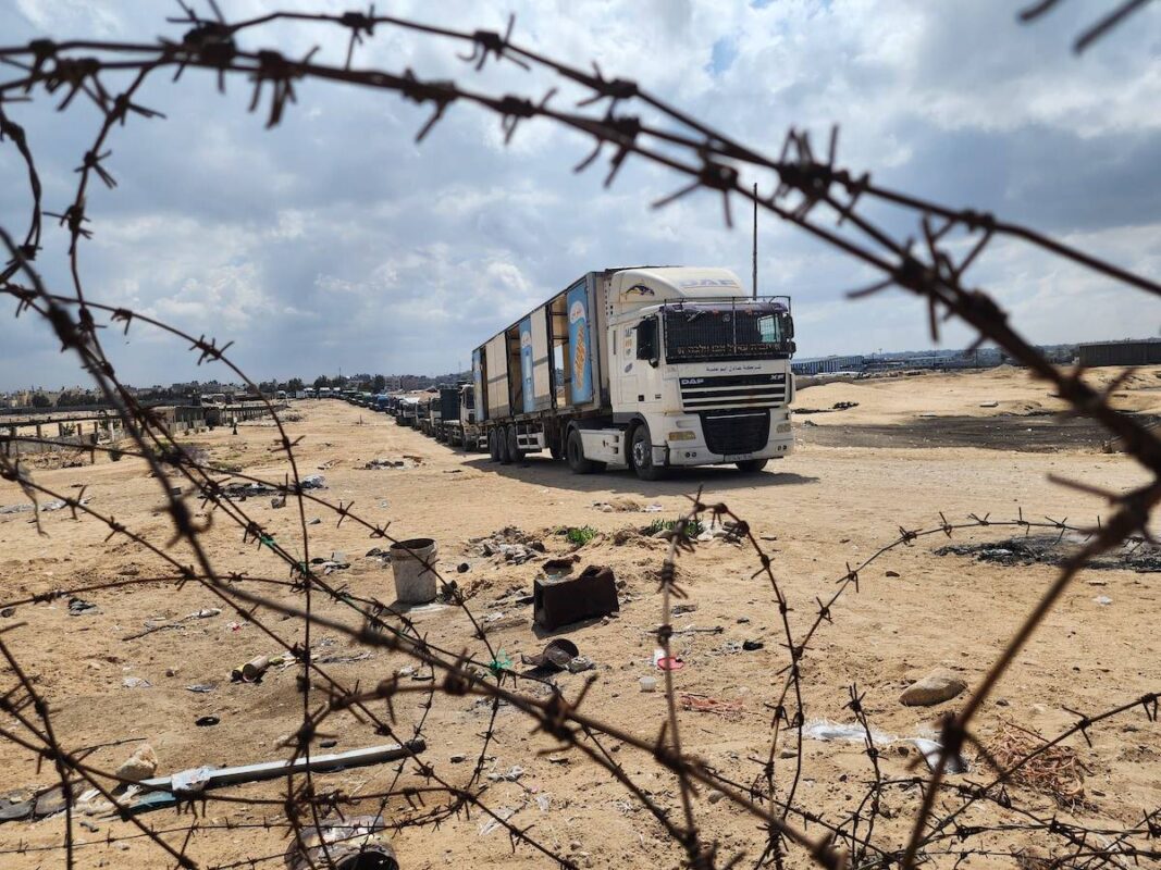 Palestinian truck drivers and United Nations vehicles wait near the Rafah border gate on the Gazan side to cross the Egyptian side, on May 14, 2024 [Hani Alshaer - Anadolu Agency]
