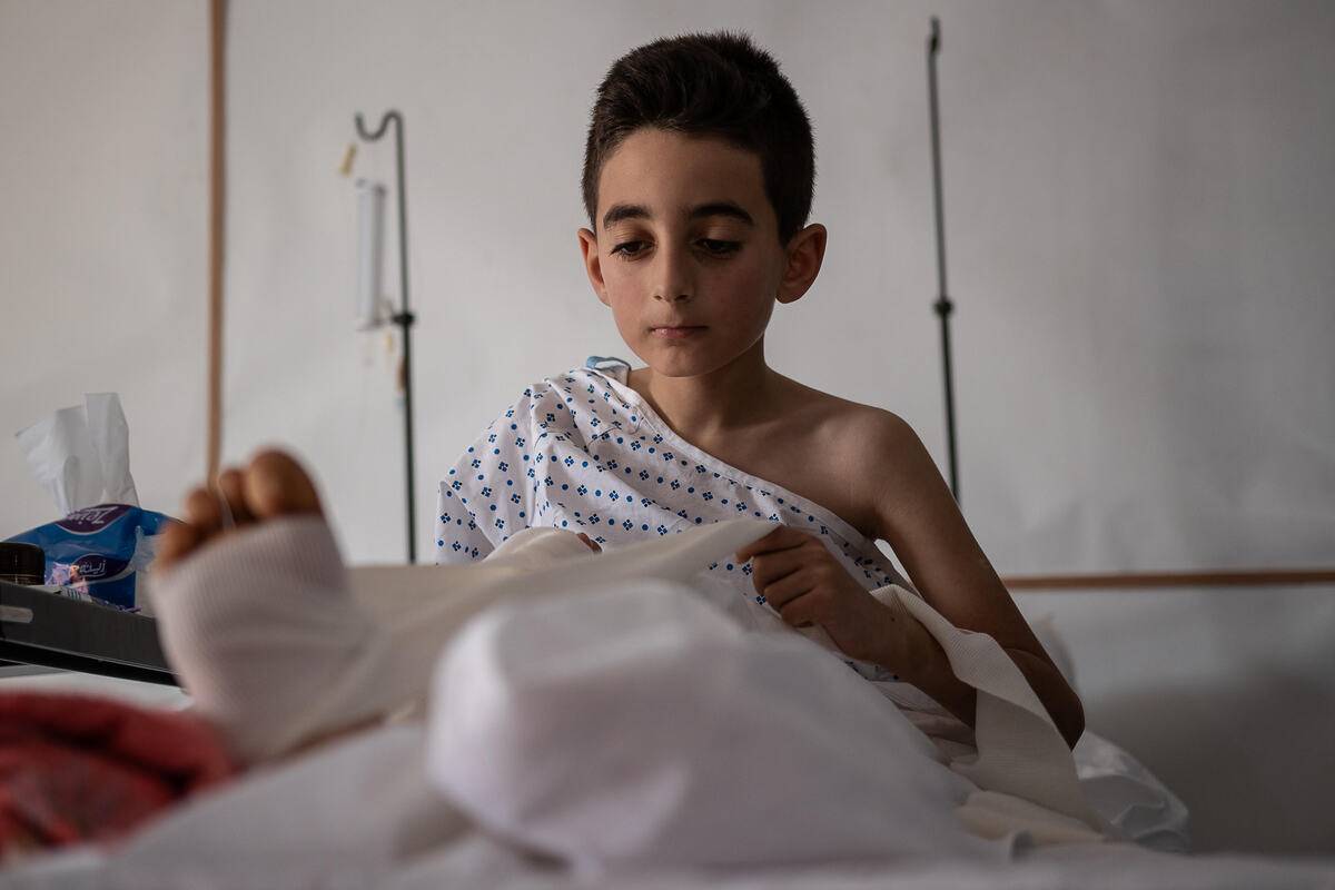 Ahmed, 10, receives physiotherapy to repair his injured leg in Gaza. [Sacha Myers/Save the Children]
