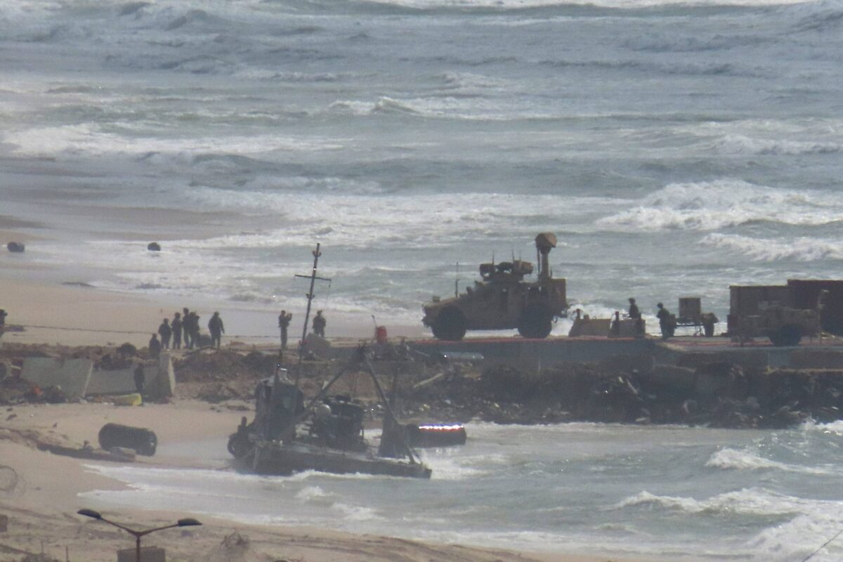 A view of the damaged floating pier, set up by US to facilitate quicker delivery of humanitarian aid to Palestinians, after it has been suspended due to adverse weather conditions and rising sea levels in Gaza City, Gaza on May 27, 2024 [Dawoud Abo Alkas - Anadolu Agency]