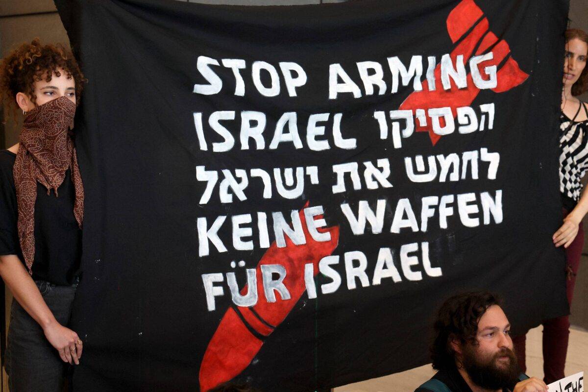 German and Israeli activists block the entrance to the German embassy in Tel Aviv during a protest calling on Germany to stop arming Israel, on June 7, 2024 [JACK GUEZ/AFP via Getty Images]