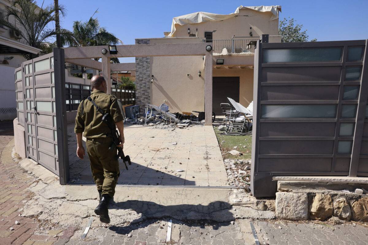 An Israeli soldier checks a house that was hit by a Hezbollah rocket in Kiryat Shmona in northern Israel near the Lebanon border, on June 16, 2024 [MENAHEM KAHANA/AFP via Getty Images]