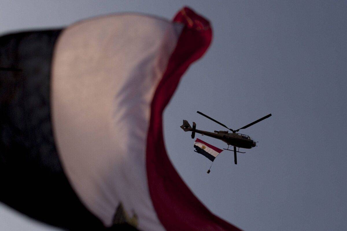 Egyptian air force helicopters circle in the sky in Cairo, Egypt on July 7, 2013 [Carsten Koall/Getty Images]