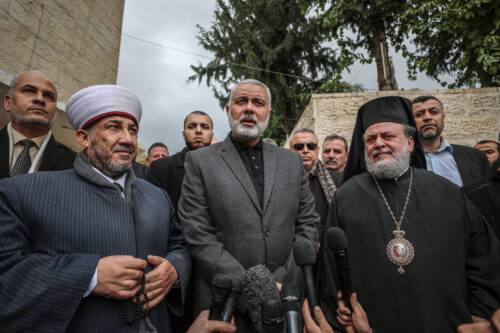 A file photo dates January 09, 2019 shows Head of the Political Bureau of Hamas, Ismail Haniyeh (C) and Archbishop Alexios (R) speaking to press during Haniyeh's visit at Saint Porphyrius Church on the occasion of Orthodox Christmas celebrations, in Gaza City, Gaza. [Ali Jadallah - Anadolu Agency]