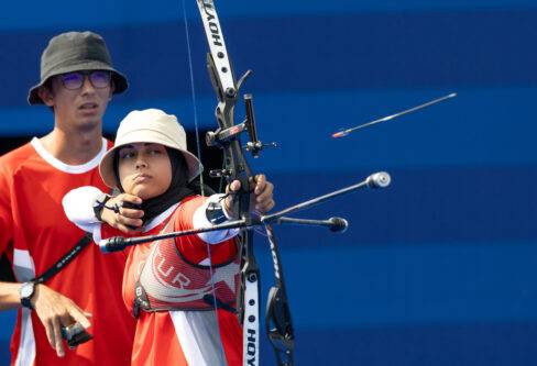 Elif Berra Gokkir and Mete Gazoz of Turkiye compete against Satsuki Noda (not seen) and Junya Nakanishi (not seen) of Japan in Archery - Mixed Team 1/8 Elimination Round on the seventh day of Olympic Games Paris 2024 at Les Invalides in Paris, France on August 2, 2024. [Aytaç Ünal - Anadolu Agency]