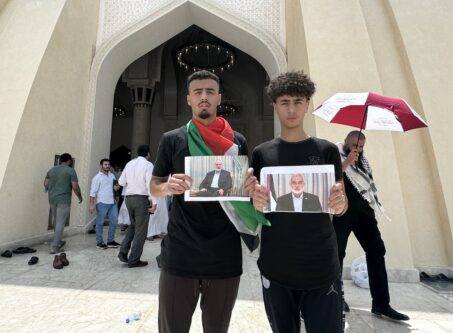 People hold a portrait of Hamas political chief Ismail Haniyeh, who was assassinated in Tehran, as they attend funeral ceremony, held for him, at Imam Abdul Wahhab Mosque in Doha, Qatar on August 2, 2024. [Ali Altunkaya - Anadolu Agency]