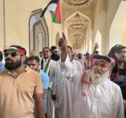 A man holds a Palestinian flag as people attend funeral ceremony, held for Hamas political chief Ismail Haniyeh, who was assassinated in Tehran, at Imam Abdul Wahhab Mosque in Doha, Qatar on August 2, 2024. [Ali Altunkaya - Anadolu Agency]