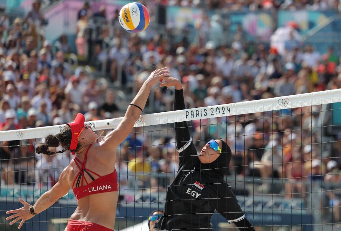 Spain's #01 Liliana Fernandez Steiner and Egypt's #02 Doaa Elghobashy fight for the ball in the women's pool A beach volleyball match between Spain and Egypt during the Paris 2024 Olympic Games at the Eiffel Tower Stadium in Paris on August 1, 2024. [THOMAS SAMSON/AFP via Getty Images]