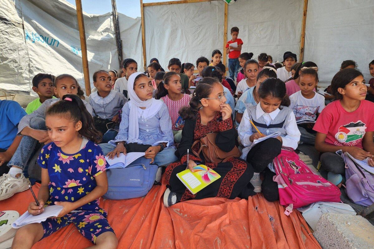 Students take part in lessons at their tent school, in which their teacher Alaa Abu Mustafa, whose house was destroyed in the Israeli army's attacks, gives them education in Khan Yunis, Gaza on September 03, 2024 [Hani Alshaer - Anadolu Agency]