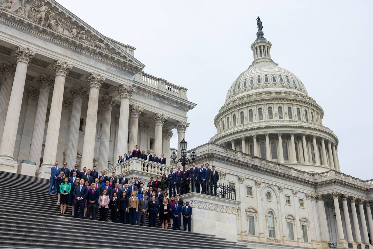 Newly elected congress members pose for a class photo in front of U.S ...