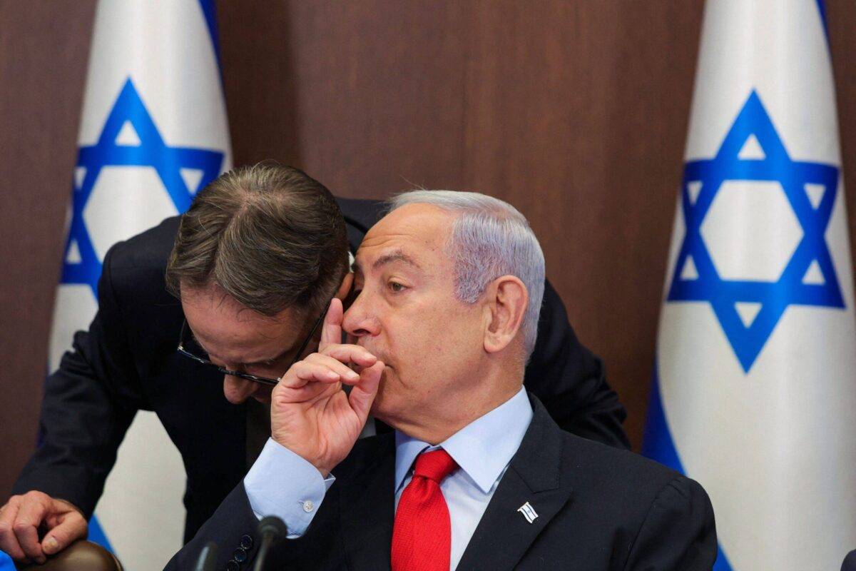 Israel's Prime Minister Benjamin Netanyahu (R) speaks to his chief of staff Tzachi Braverman during the weekly cabinet meeting in the prime minister's office in Jerusalem on July 30, 2023. (Photo by ABIR SULTAN / POOL / AFP) (Photo by ABIR SULTAN/POOL/AFP via Getty Images)