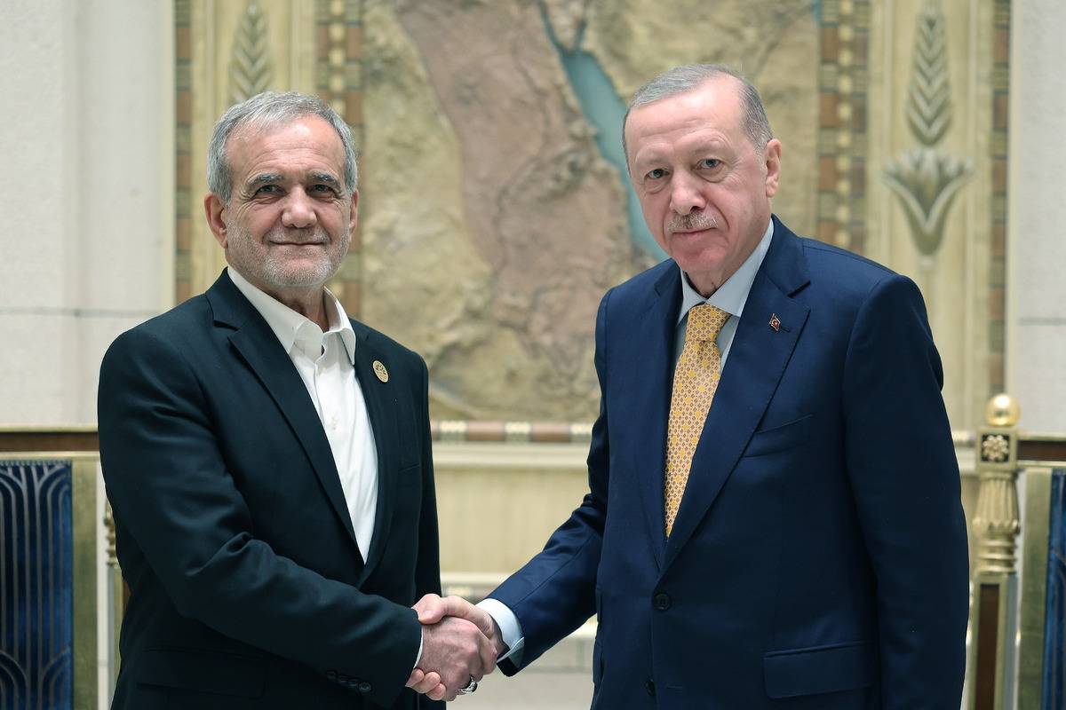 Turkish President Recep Tayyip Erdogan (R) meets with Iranian President Masoud Pezeshkian (L) during his visit for the summit of the Developing Eight Organization for Economic Cooperation (D-8), in Cairo, Egypt on December 19, 2024. [Turkish Presidency - Anadolu Agency]