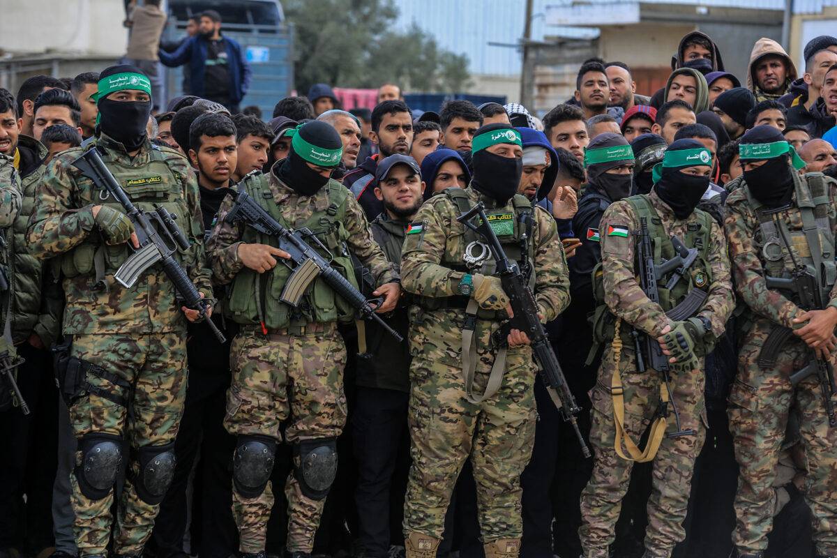 Members of the Al-Qassam Brigades, the military wing of Hamas, take security measures as Israeli hostages being handed over Red Cross, in Deir al Balah, Gaza, on February 8, 2025 [Abed Rahim Khatib/Anadolu Agency]