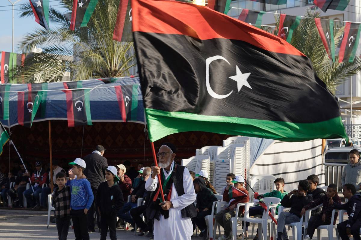 People carrying Libyan flags gather at the main square of Tajoura district as part of the celebrations organized by the municipality to mark the 14th anniversary of the February 17 Revolution in Tripoli, Libya. [Hazem Turkia - Anadolu Agency]