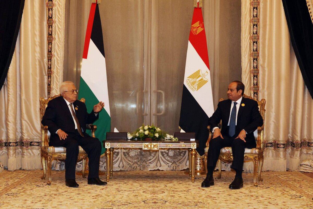 Palestinian President Mahmoud Abbas (L) meets with Egyptian President Abdel Fattah al-Sisi (R) on the sidelines of the Emergency Arab summit in Cairo, Egypt, on March 04, 2025 [Palestinian Presidency/Handout - Anadolu Agency]