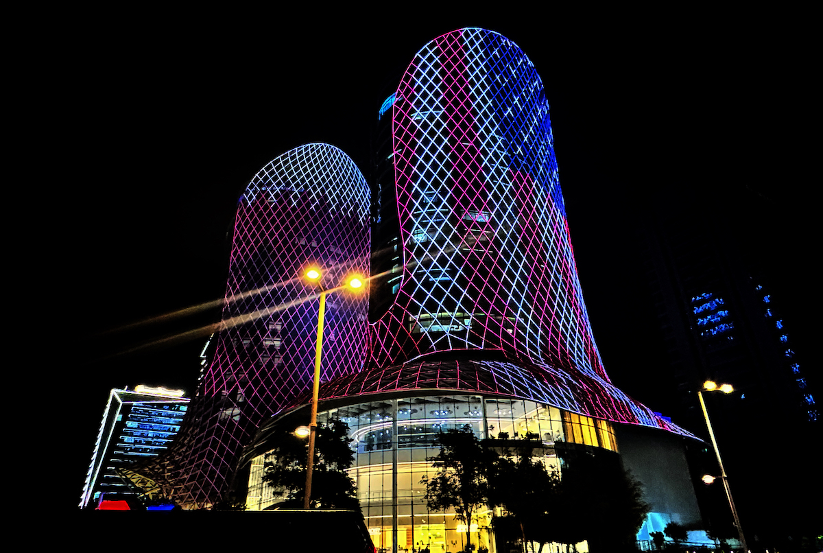 Skyscrapers are illuminated with red, white and blue colors of the US flag for the US President Donald Trump's visit in Doha, Qatar on May 14, 2025. [Ali Altunkaya - Anadolu Agency]