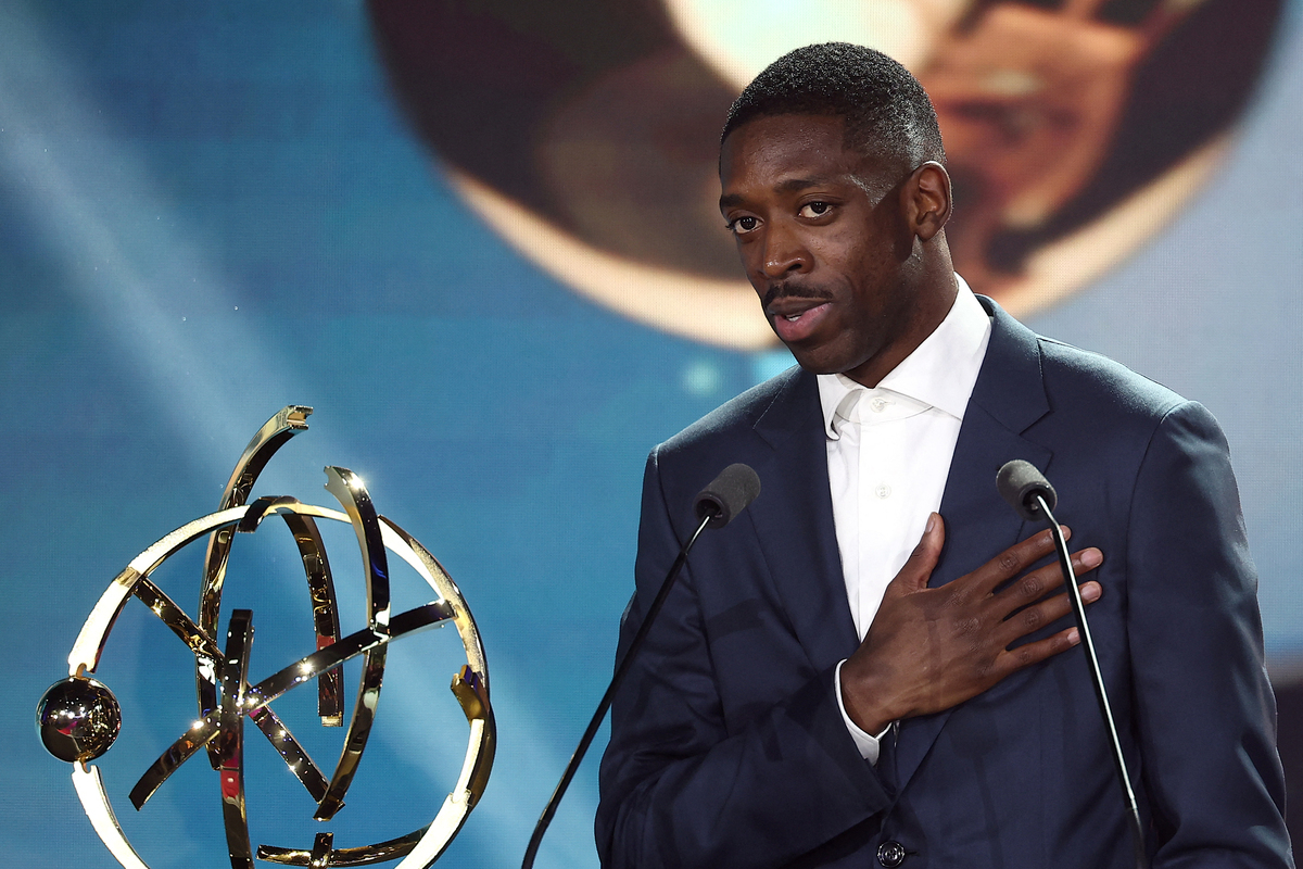 Paris Saint-Germain's French forward #10 Ousmane Dembele reacts after receiving the French Ligue 1 Best Football Player award during the televised UNFP (French National Professional Football players Union) trophy ceremony, in Paris on May 11, 2025. [Photo by FRANCK FIFE/AFP via Getty Images]