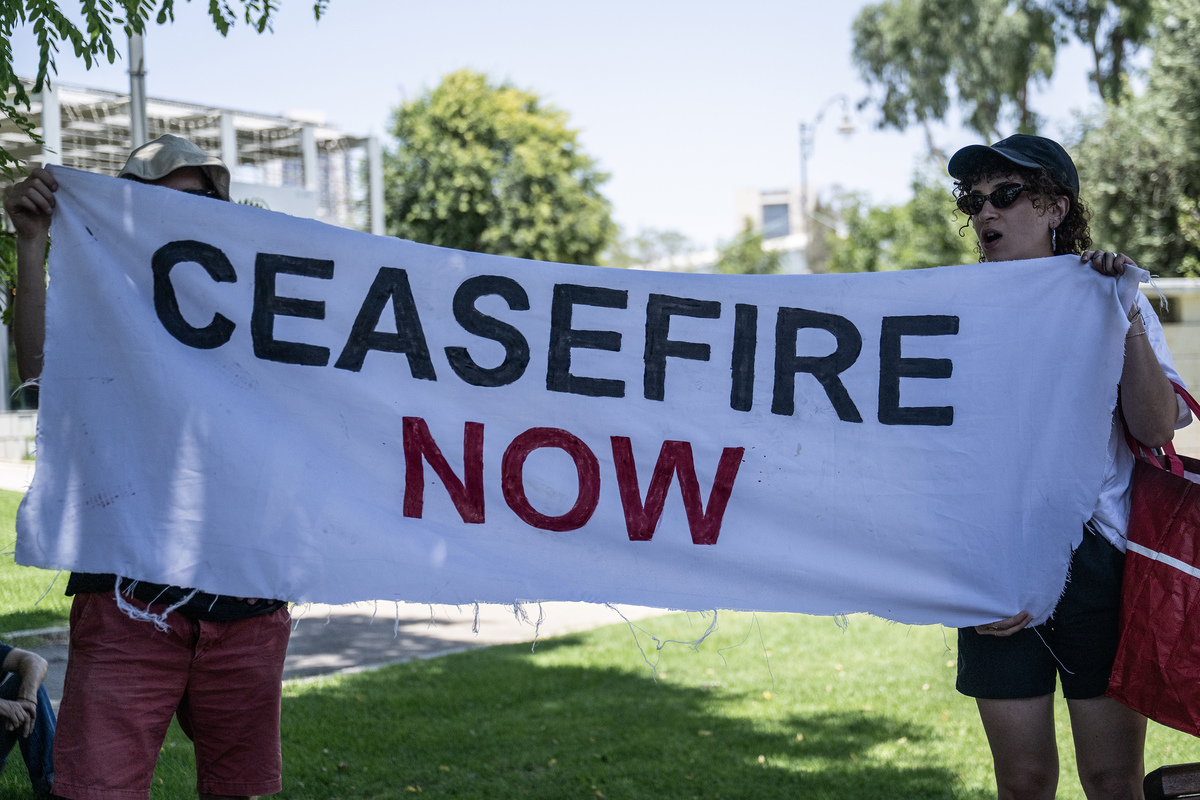 A group of Jewish activists, holding banners, gather for a protest, against the activities of the US-Israeli-led Gaza Humanitarian Foundation (GHF) in front of the US Consulate General in West Jerusalem on July 11, 2025. [Mostafa Alkharouf - Anadolu Agency]