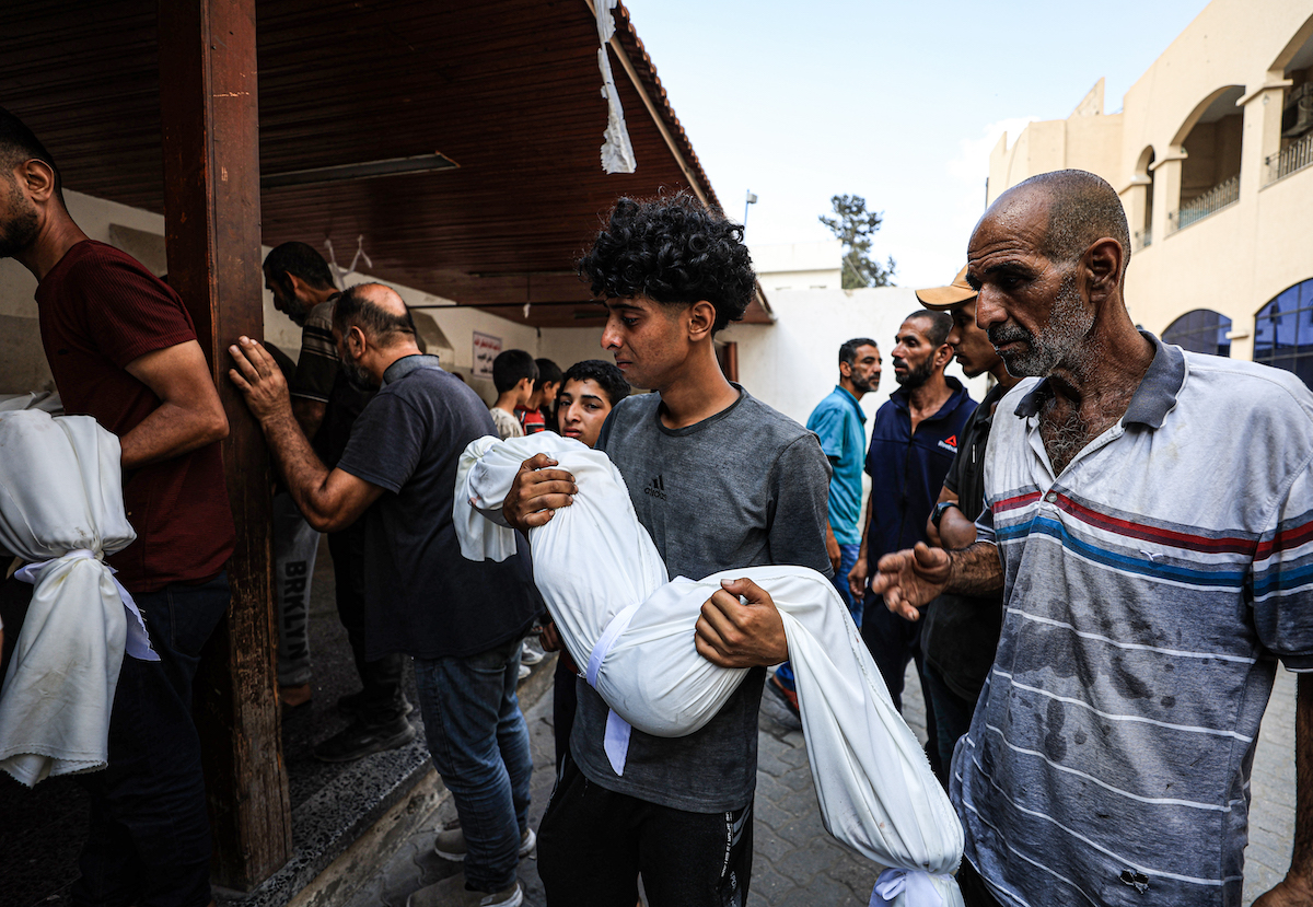 Relatives of Palestinians, who lost their lives following the Israeli attack on tents of displaced Palestinians in the al-Nafq area, mourn as the bodies are brought to al-Ahli Baptist Hospital for funeral process in Gaza City, Gaza on July 19, 2025. [Dawoud Abo Alkas - Anadolu Agency]