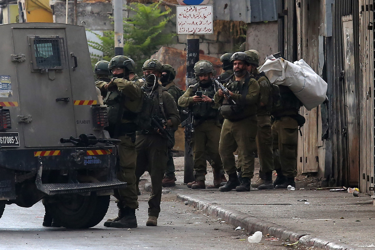 A view of the clashes that broke out Israeli soldiers and Palestinian youths protesting the raid of Israeli forces after Israeli army carried out a raid in Nablus, West Bank on August 27, 2025. [Nedal Eshtayah - Anadolu Agency]