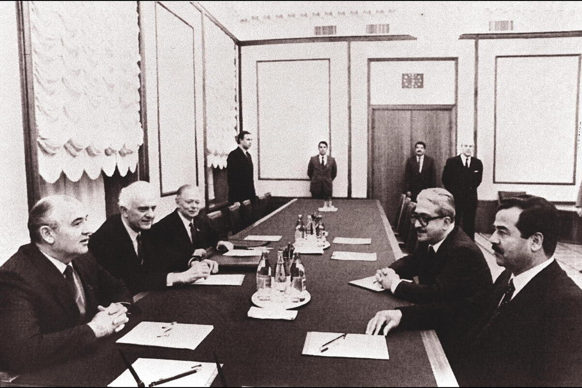 This file picture dated 16 December 1985 shows Iraq's toppled president Saddam Hussein (R) and former deputy prime minister Tareq Aziz (2nd R) during a meeting in Moscow with General Secretary of the CPSU Central Committee Mikhail Gorbachev (L) and his Foreign Minister Eduard Shevardnadze (2nd L). [Photo credit should read -/AFP via Getty Images]