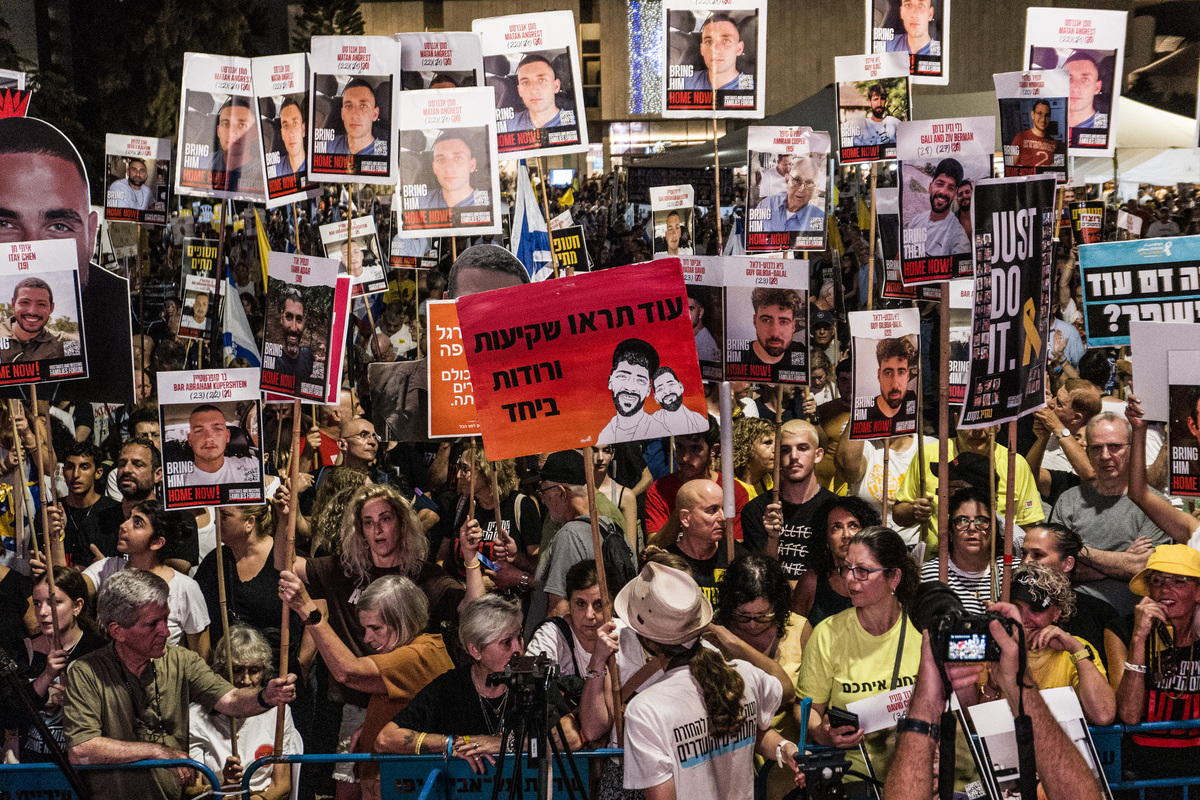 Israeli protesters gather in Hostage Square with banners and photos of Israeli hostages during the demonstration demanding an agreement for the release of Israeli hostages in Gaza on September 13, 2025 in Tel Aviv, Israel. [Mostafa Alkharouf - Anadolu Agency]
