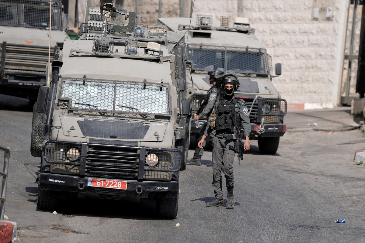 The Israeli military conduct a raid in Ramallah and detain a Palestinian youth with his eyes blindsided, on September 16, 2025, in West Bank. [Issam Rimawi - Anadolu Agency]